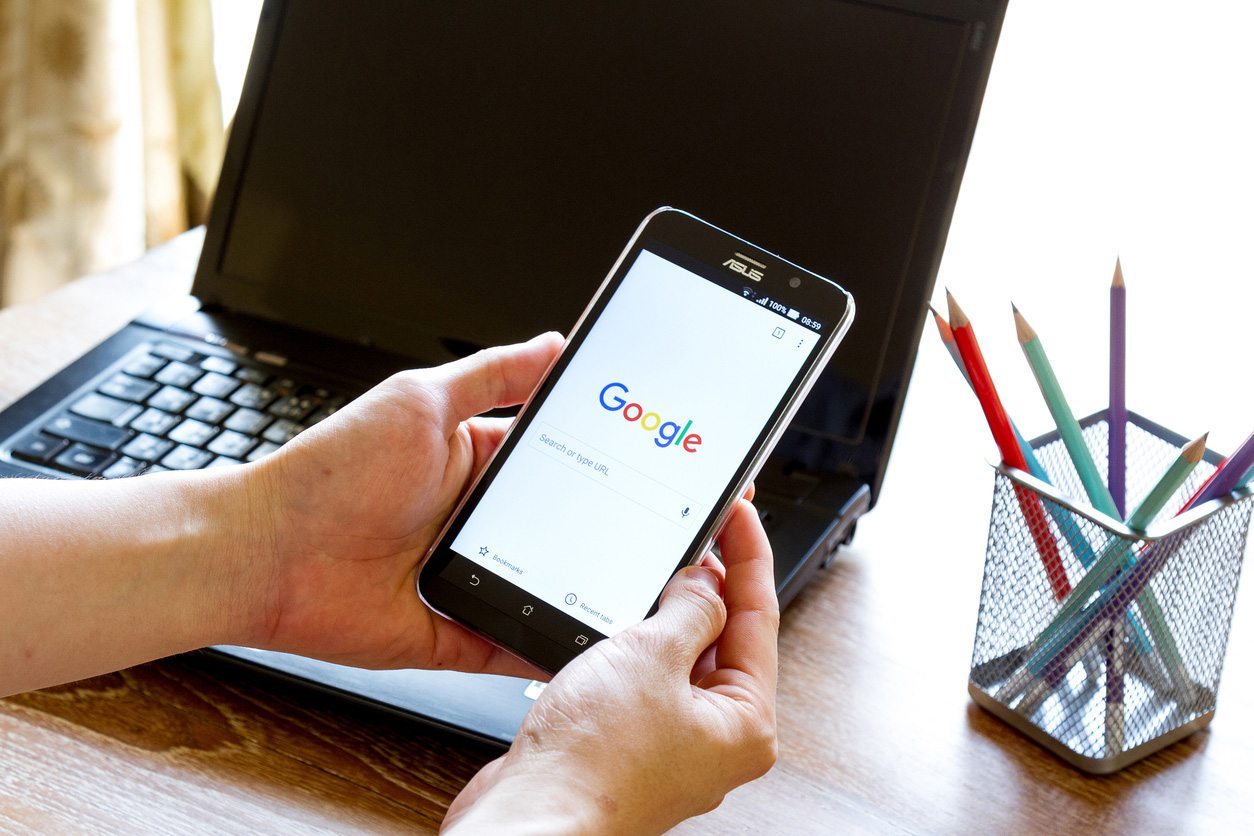Mobile phone displaying Google search screen